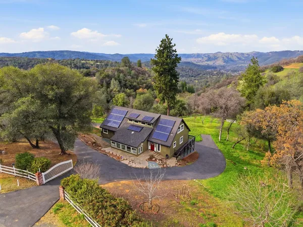 an aerial view of a house with a garden
