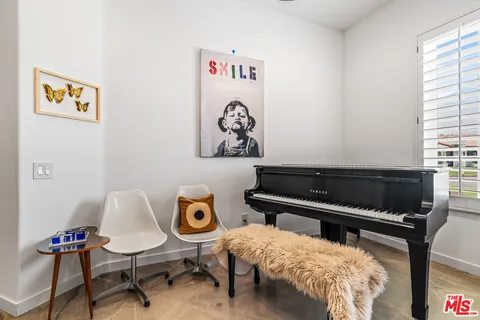 a view of workspace with furniture and window