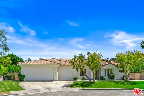 a living room with furniture kitchen view and a dining table
