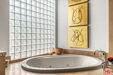 a view of a house with a backyard patio and a garden