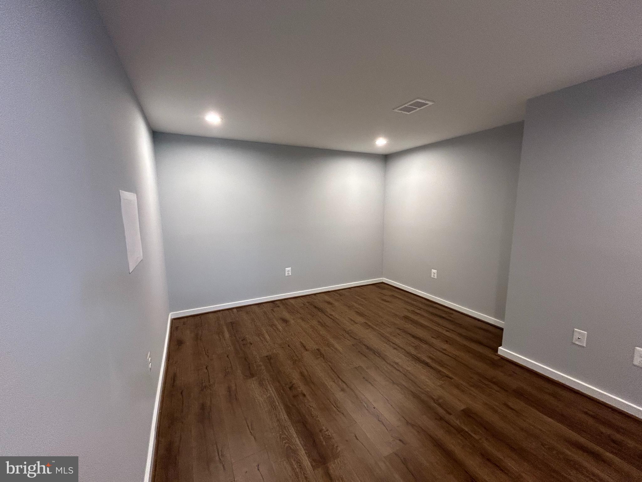 238 Ternwing Drive Arnold, MD 21012 - Photo 17 of 22 an empty room with wooden floor and windows