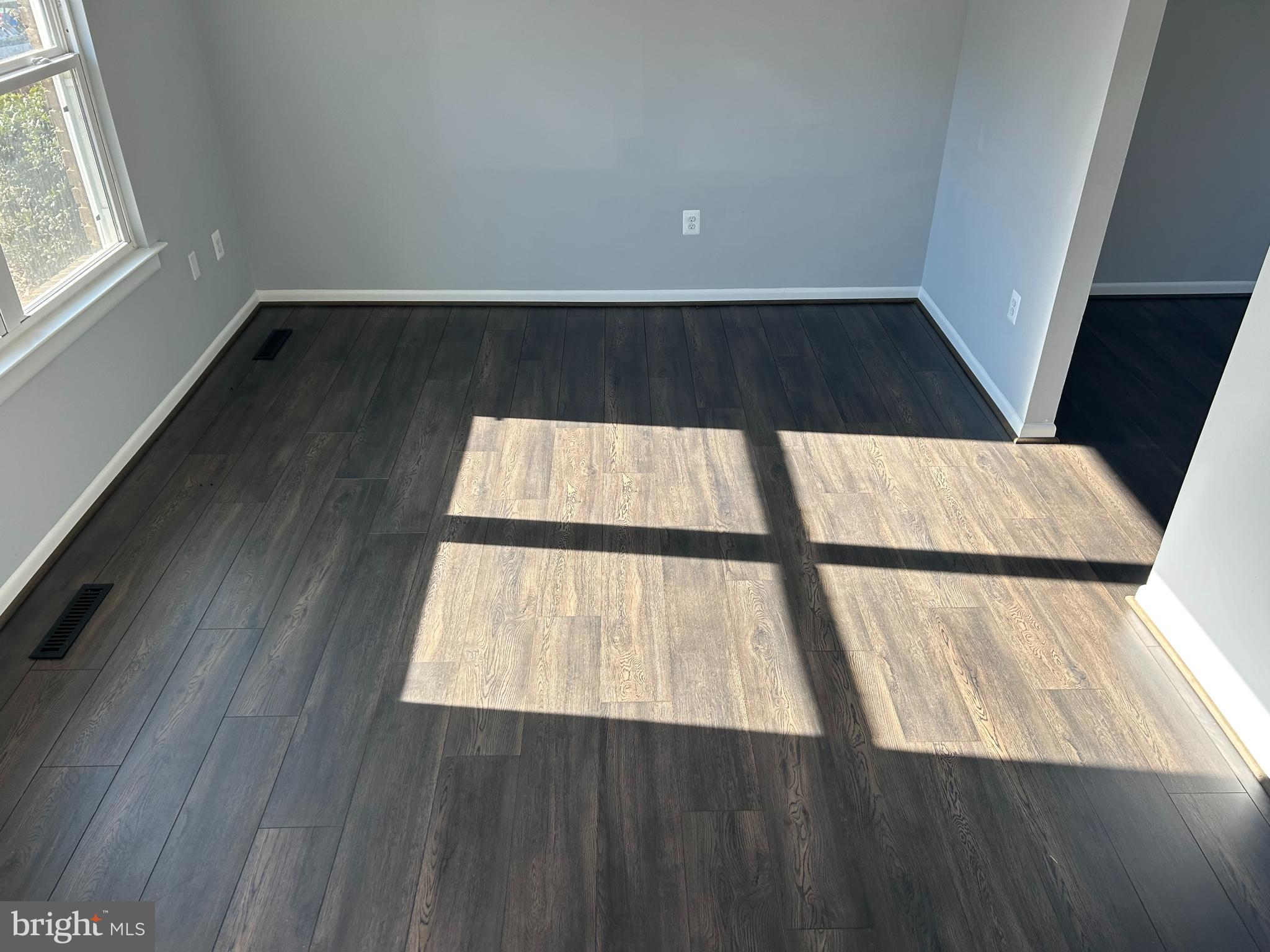 238 Ternwing Drive Arnold, MD 21012 - Photo 4 of 22 a view of an empty room with wooden floor and windows