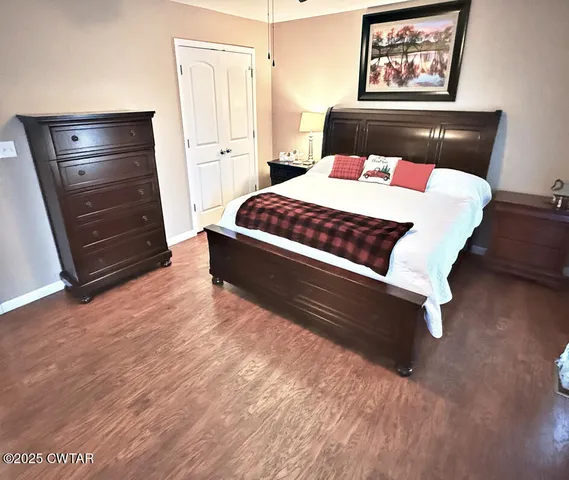 a bedroom with a bed and a dresser
