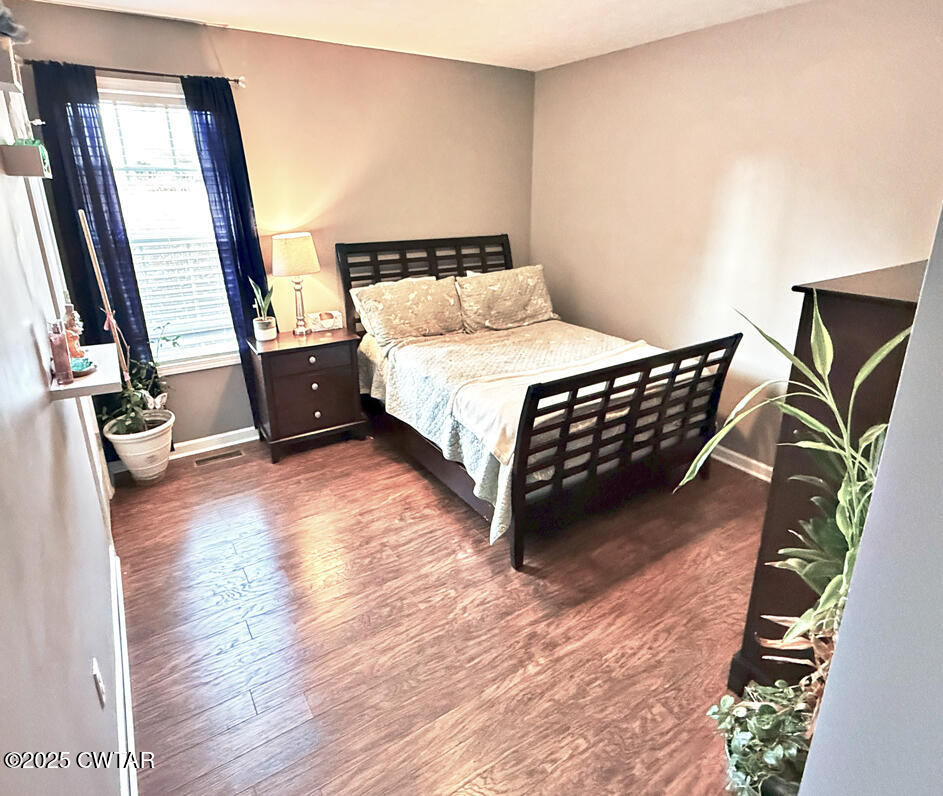 759 Timber Ridge Drive Lexington, TN 38351 - Photo 14 of 18 a bedroom with a bed window and a balcony