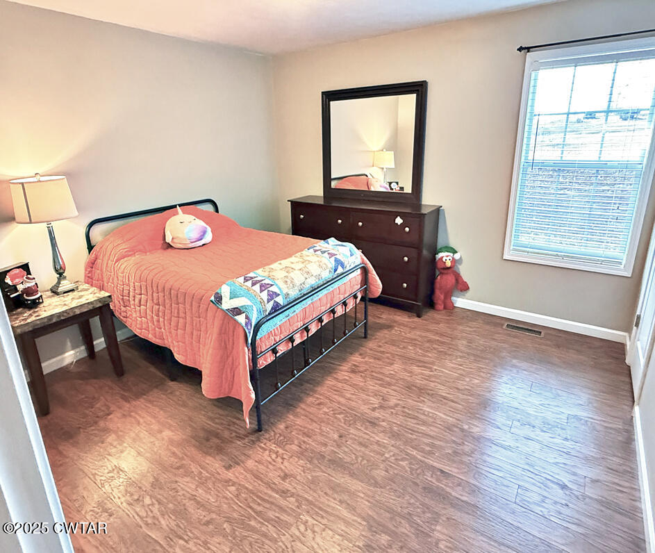 759 Timber Ridge Drive Lexington, TN 38351 - Photo 15 of 18 a bedroom with a bed and window