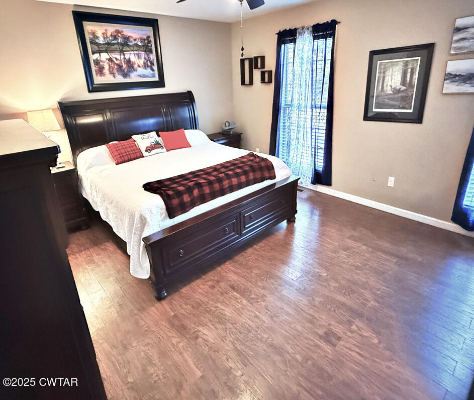 759 Timber Ridge Drive Lexington, TN 38351 - Photo 10 of 18 a bed sitting in a bedroom next to a window