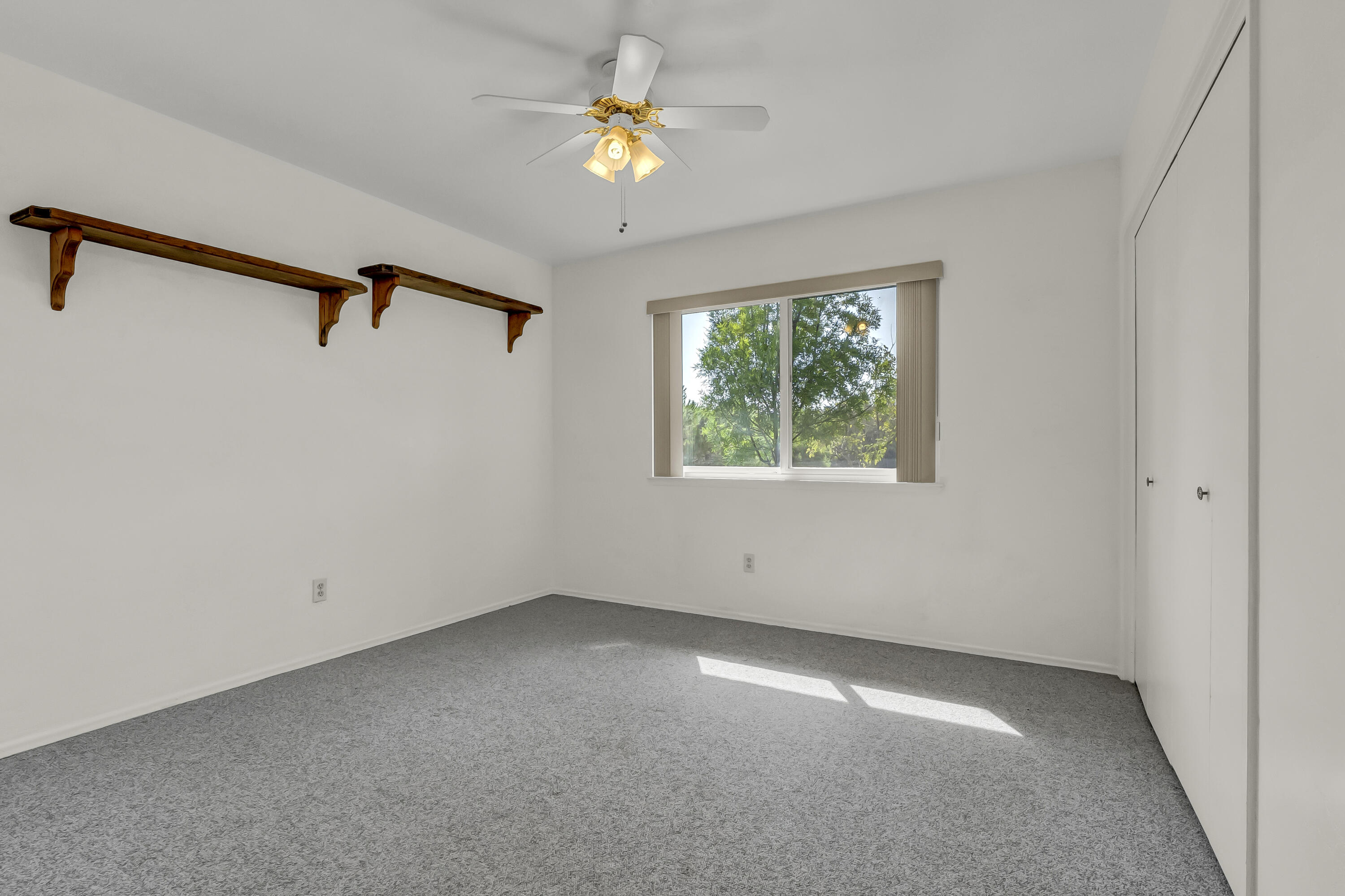 18002 320th Road Springville, CA 93265 - Photo 33 of 56 an empty room with windows and fan