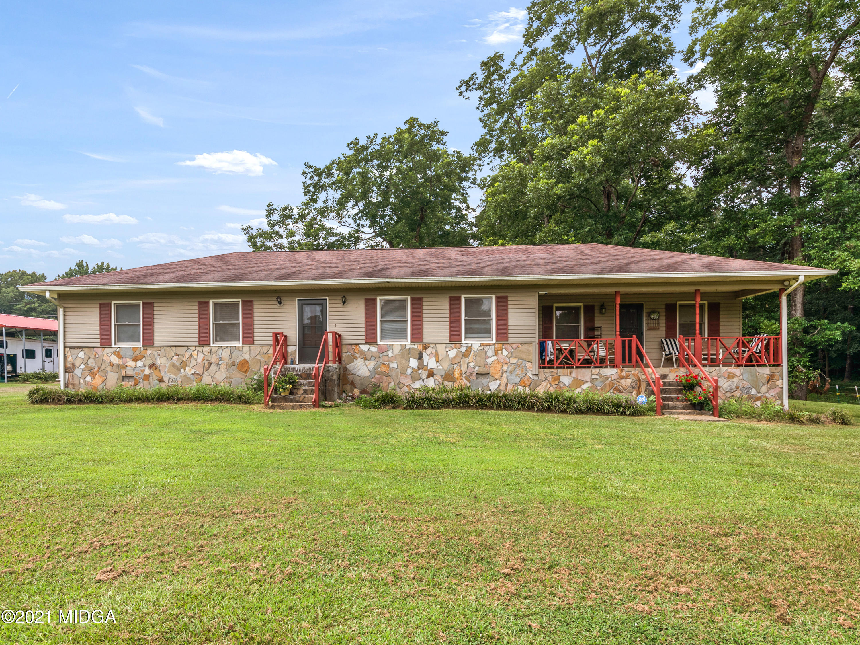 747 Chuli Road Griffin, GA 30223 - Photo 1 of 45 a front view of a house with a garden