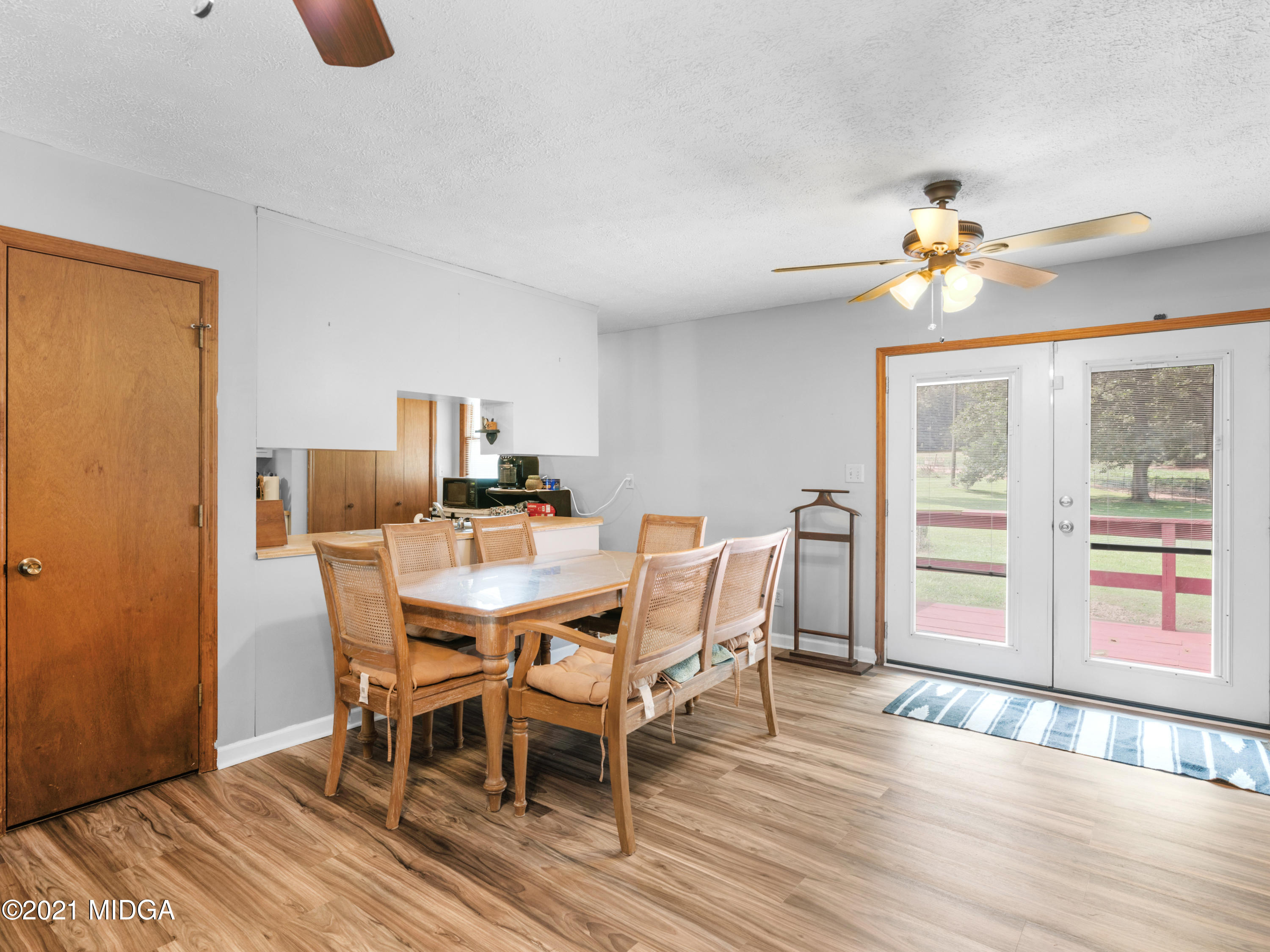 747 Chuli Road Griffin, GA 30223 - Photo 12 of 45 a view of a dining room with furniture window and wooden floor