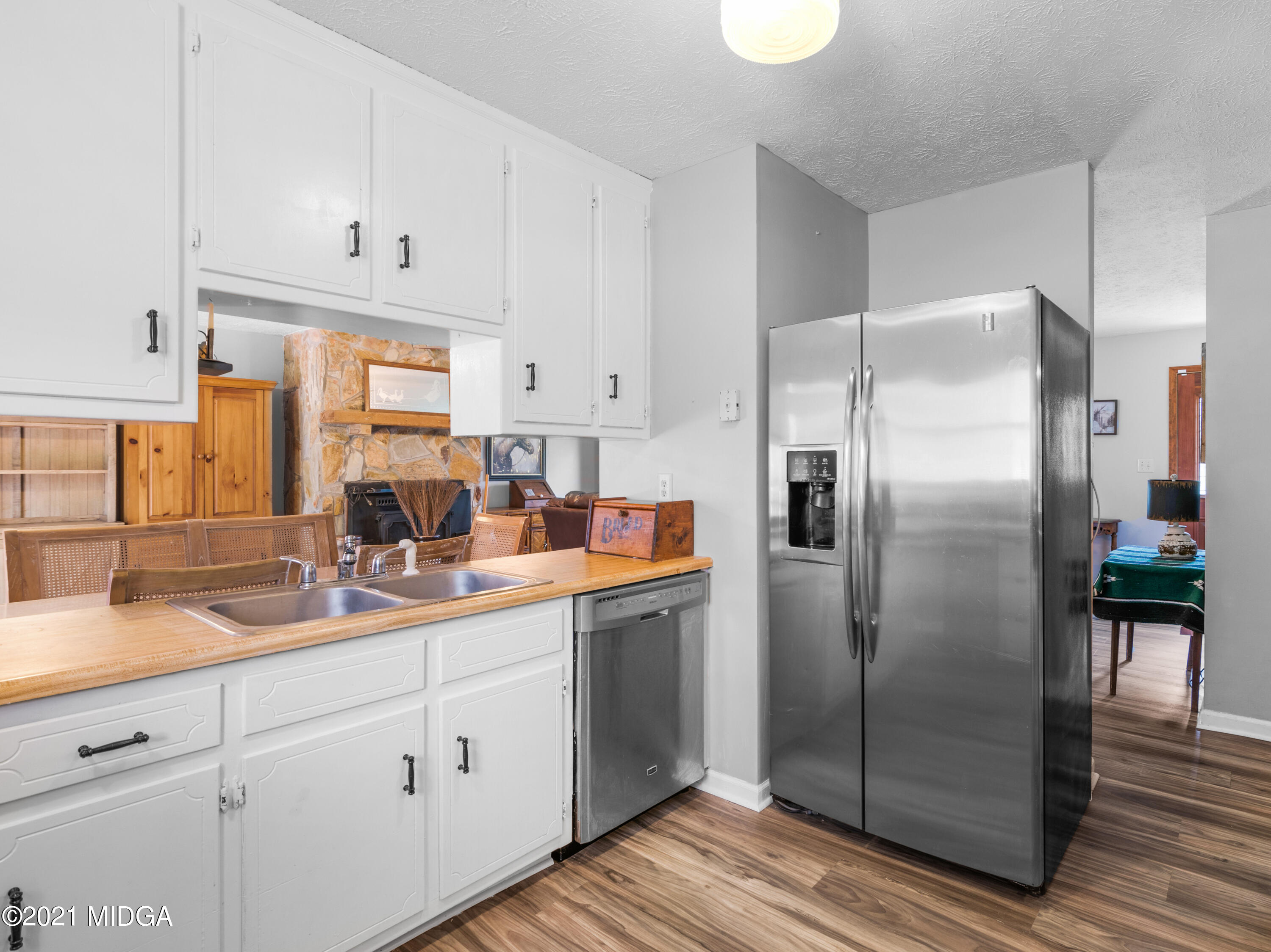 747 Chuli Road Griffin, GA 30223 - Photo 18 of 45 a kitchen with white cabinets and stainless steel appliances