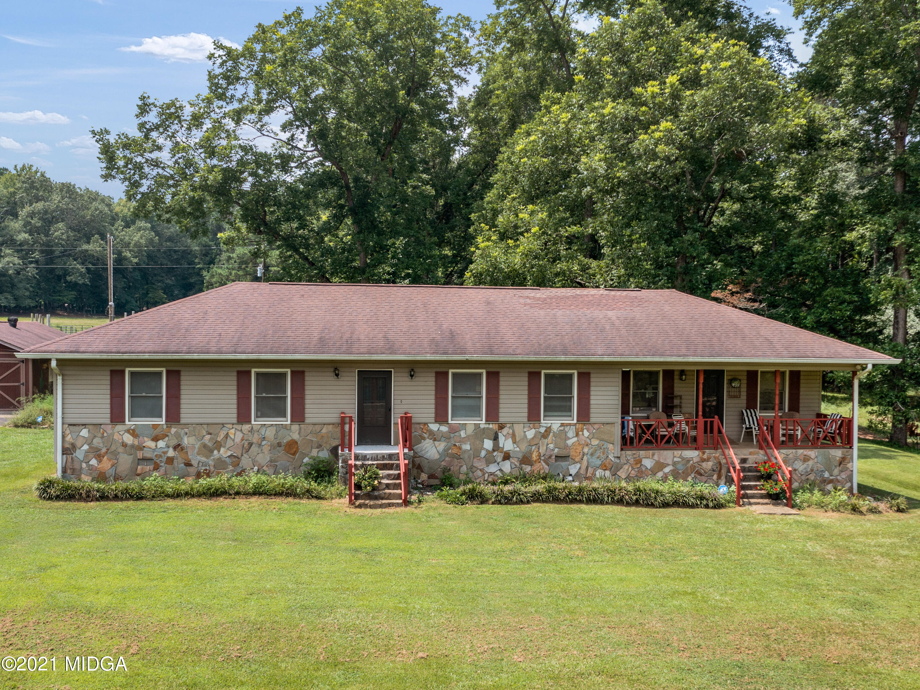 747 Chuli Road Griffin, GA 30223 - Photo 3 of 45 a backyard of a house with yard table and chairs