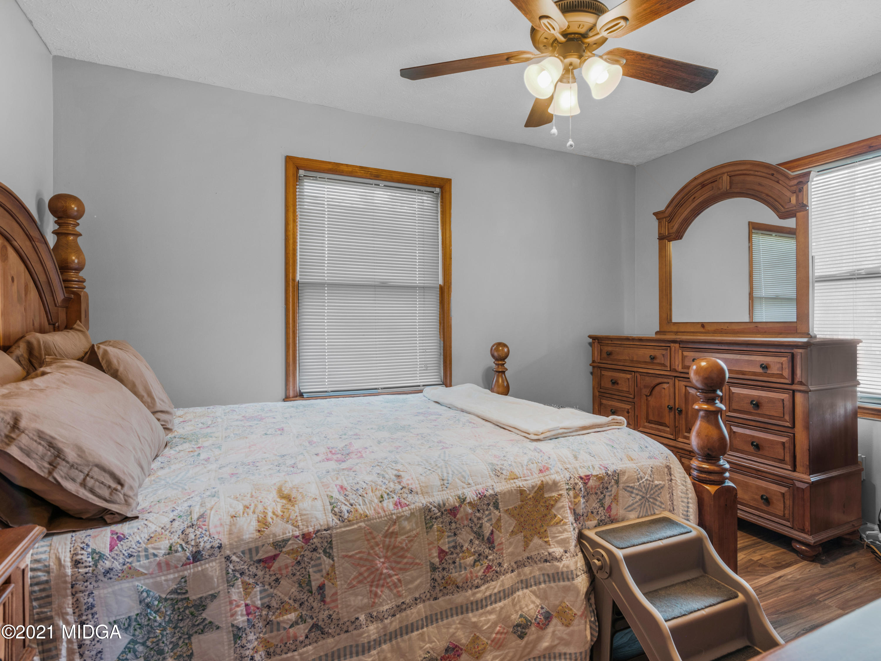 747 Chuli Road Griffin, GA 30223 - Photo 25 of 45 a bedroom with a bed and a dresser