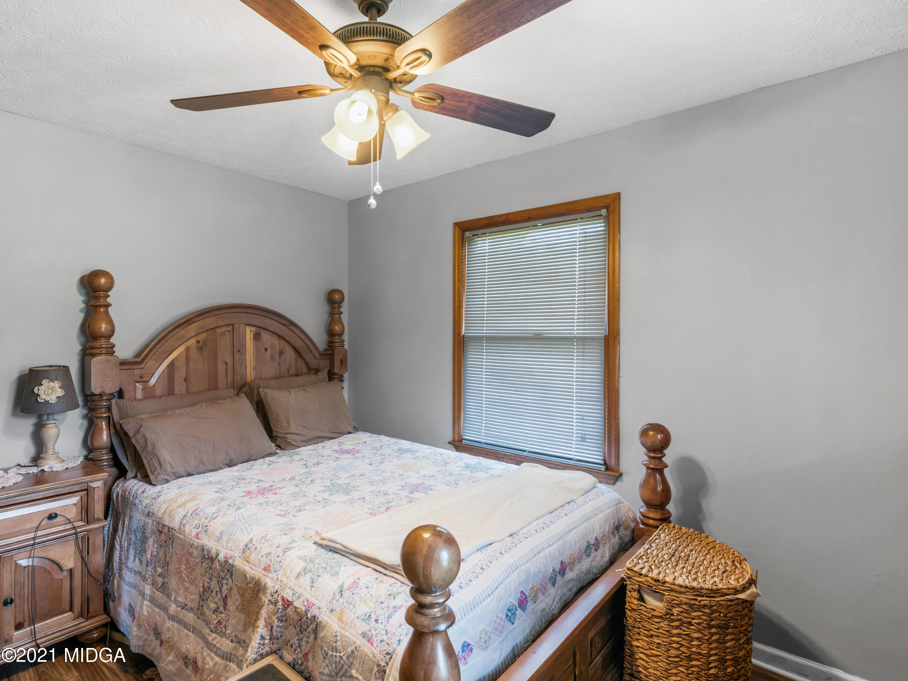 747 Chuli Road Griffin, GA 30223 - Photo 26 of 45 a bedroom with a bed and a dresser