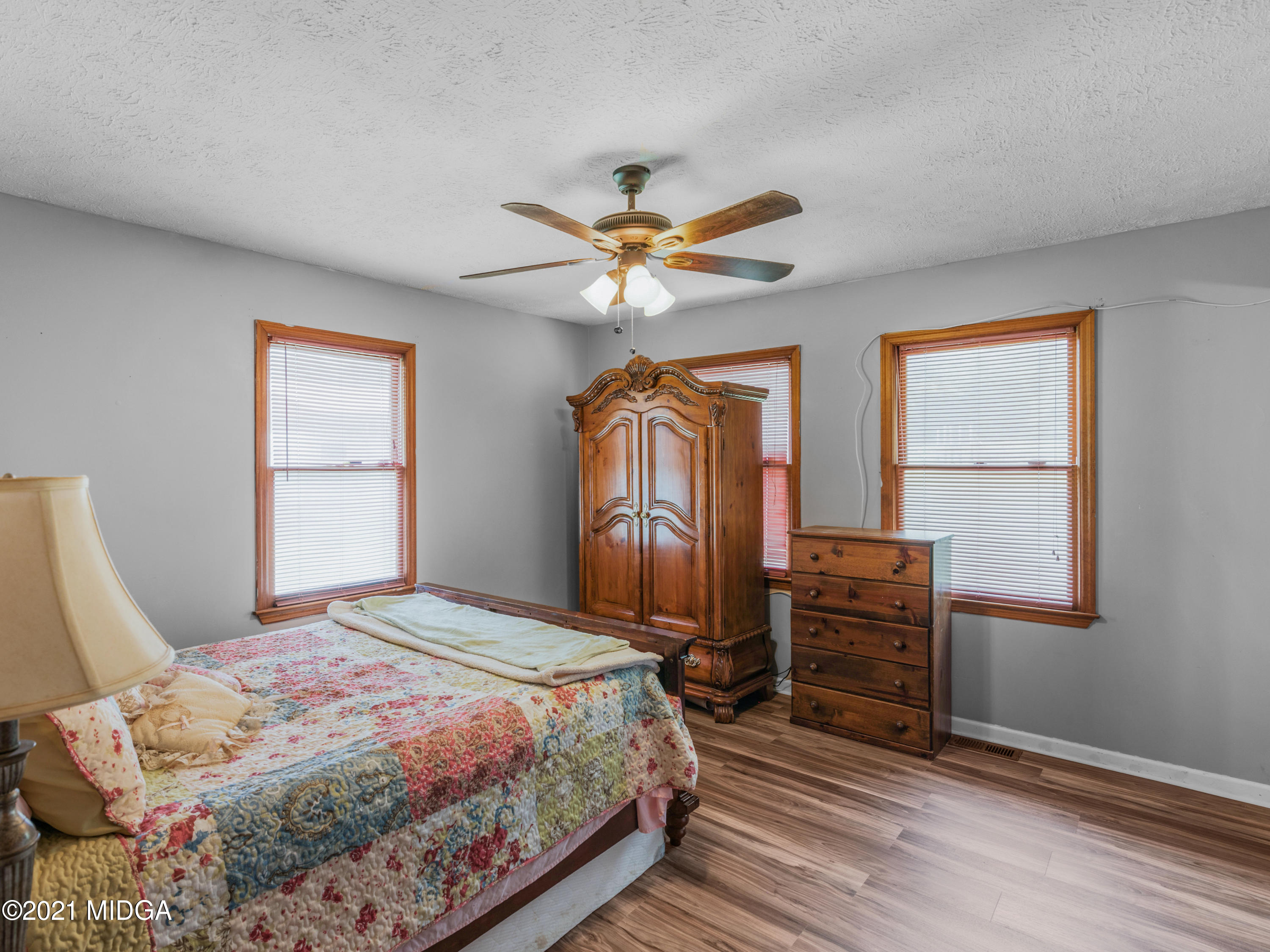 747 Chuli Road Griffin, GA 30223 - Photo 28 of 45 a bedroom with a bed dresser and a window