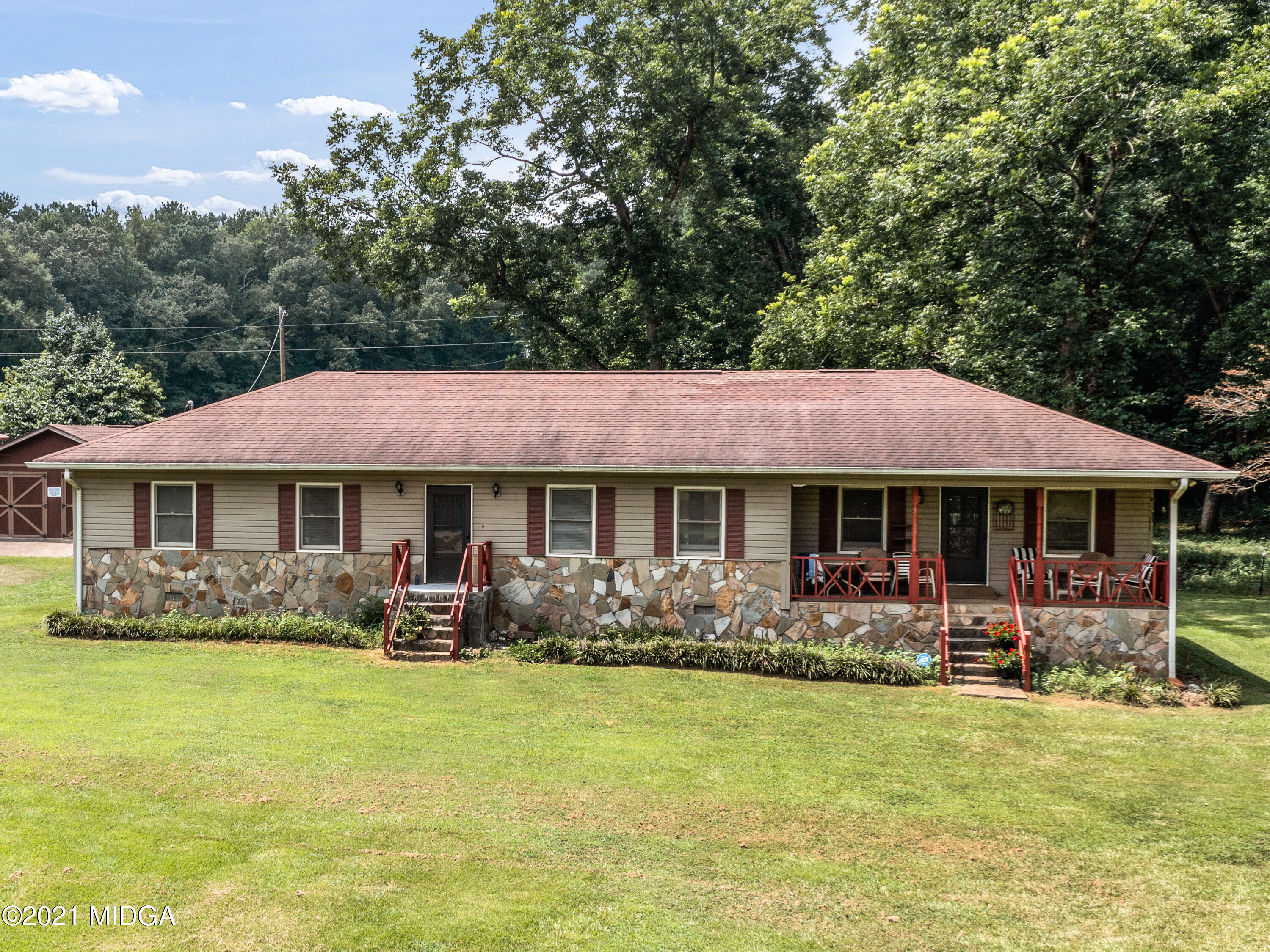 747 Chuli Road Griffin, GA 30223 - Photo 4 of 45 a front view of a house with garden