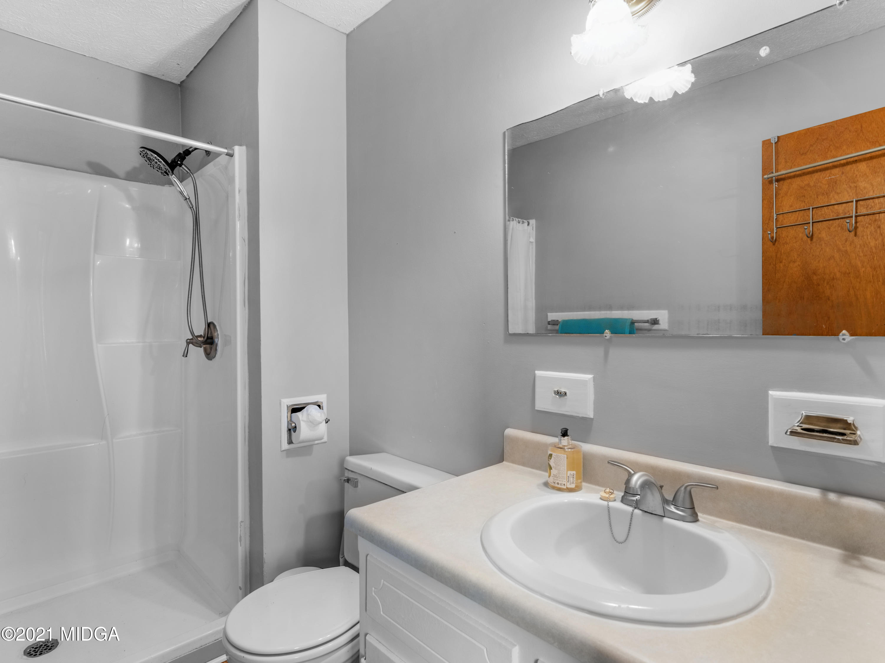 747 Chuli Road Griffin, GA 30223 - Photo 31 of 45 a bathroom with a sink toilet and shower