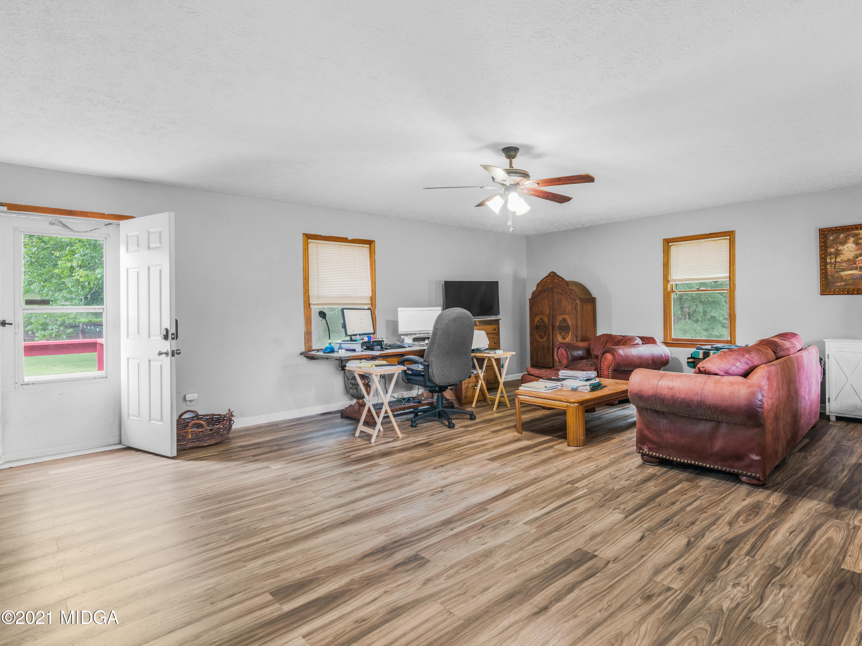 747 Chuli Road Griffin, GA 30223 - Photo 32 of 45 a living room with furniture a window and a table
