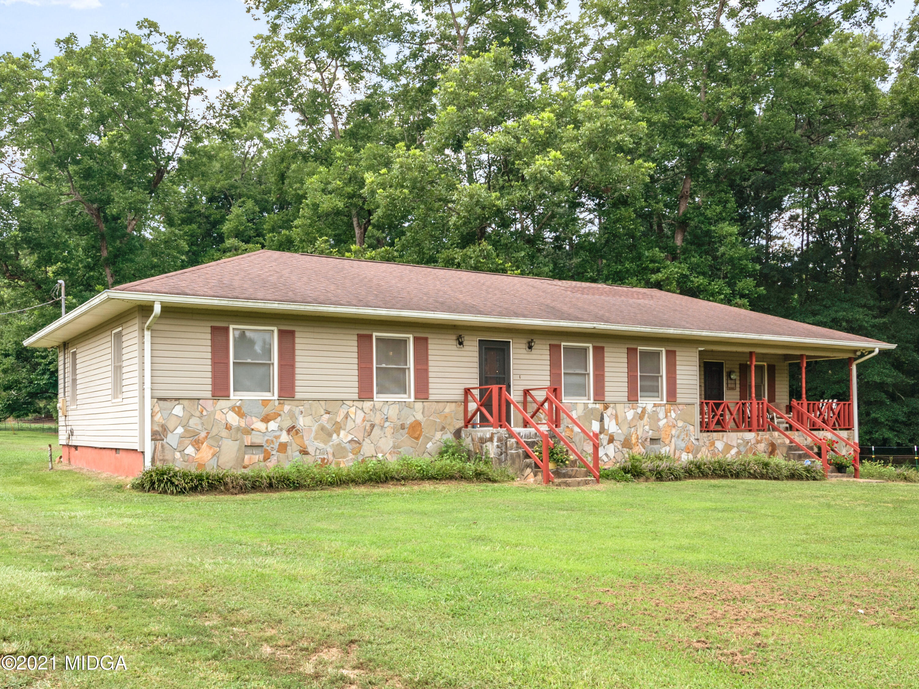 747 Chuli Road Griffin, GA 30223 - Photo 38 of 45 a front view of a house with garden