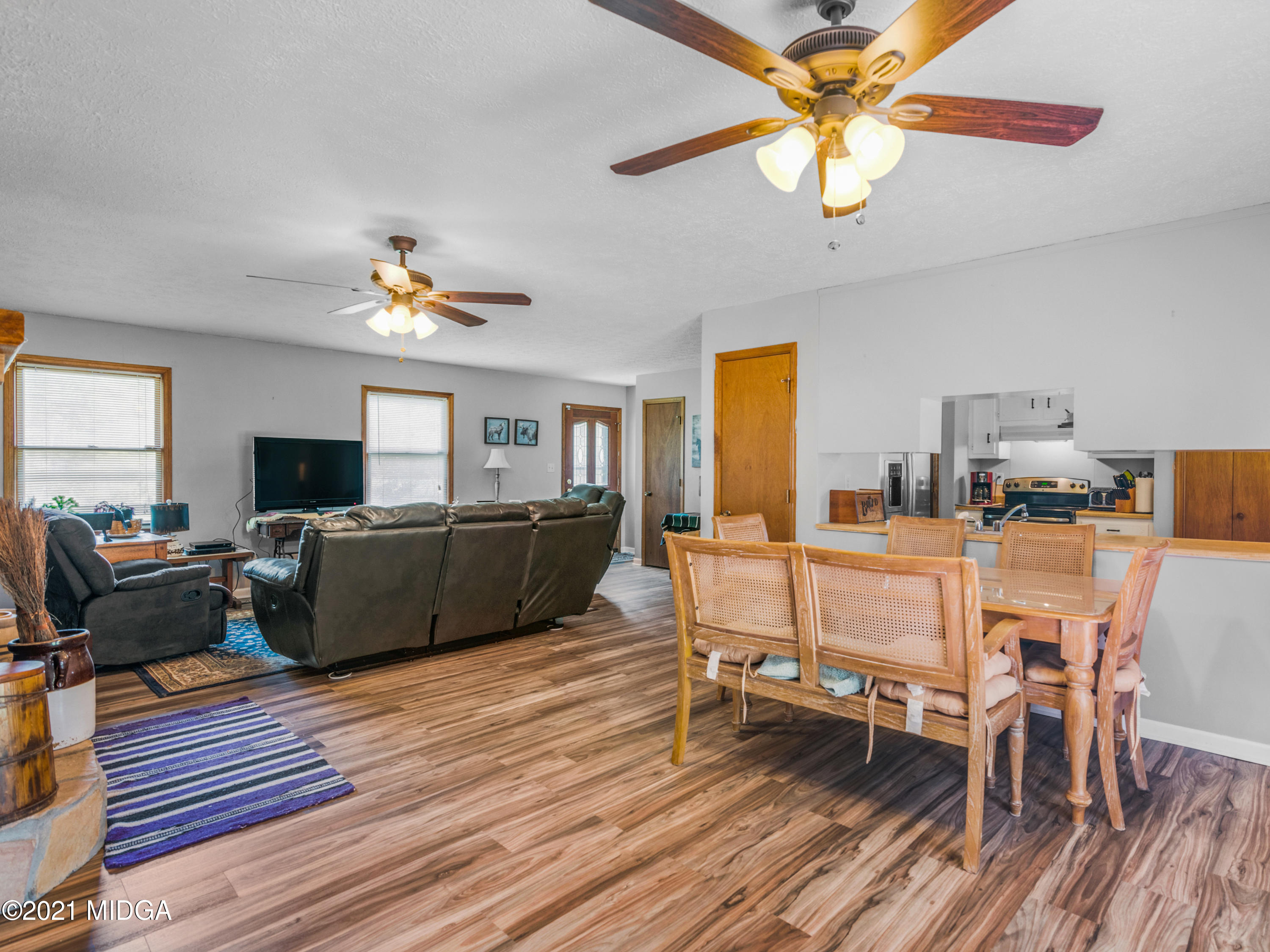 747 Chuli Road Griffin, GA 30223 - Photo 10 of 45 a living room with furniture and a wooden floor