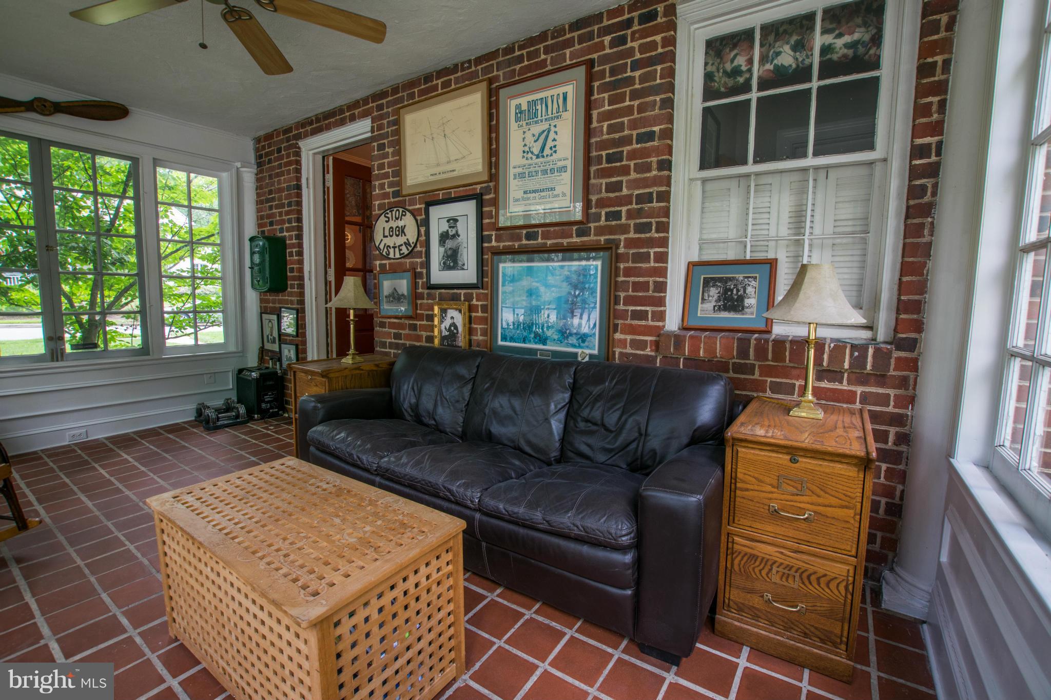 122 Midhurst Road Baltimore, MD 21212 - Photo 11 of 21 a living room with furniture and a floor to ceiling window