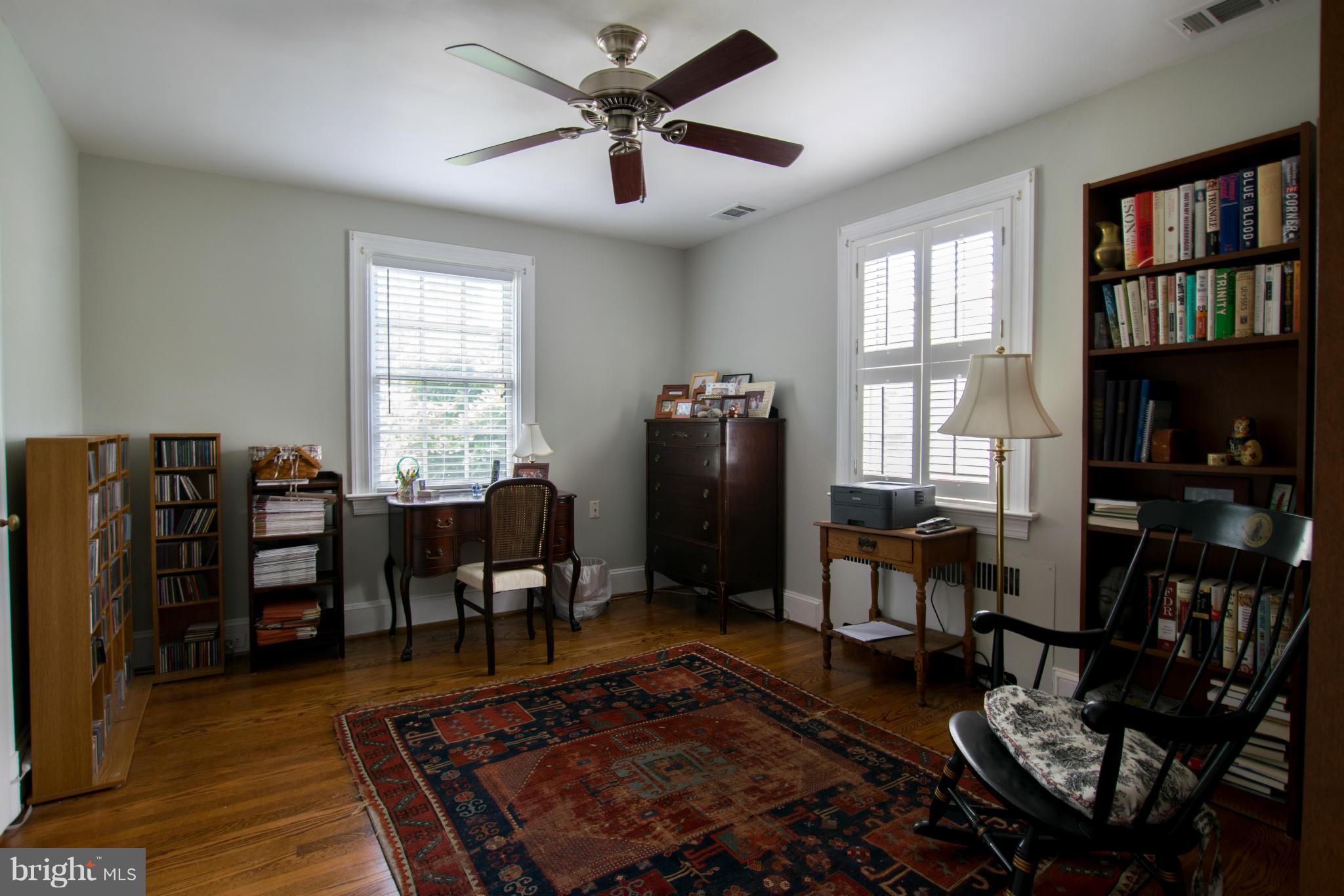 122 Midhurst Road Baltimore, MD 21212 - Photo 16 of 21 a living room with furniture a window and bookshelf