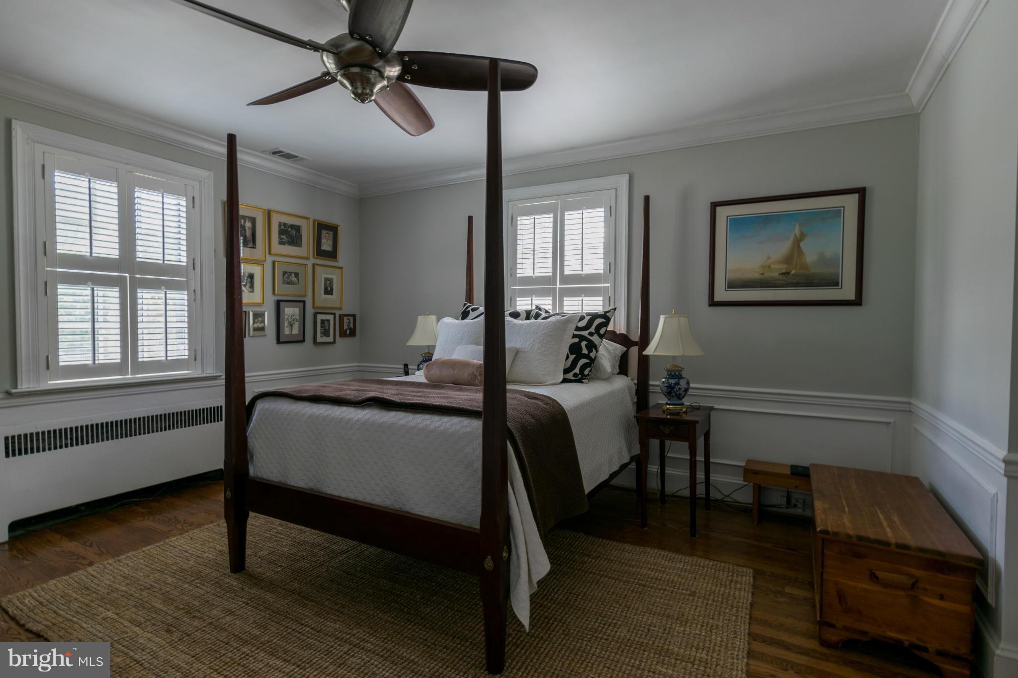 122 Midhurst Road Baltimore, MD 21212 - Photo 17 of 21 a bedroom with a bed wooden floor and window