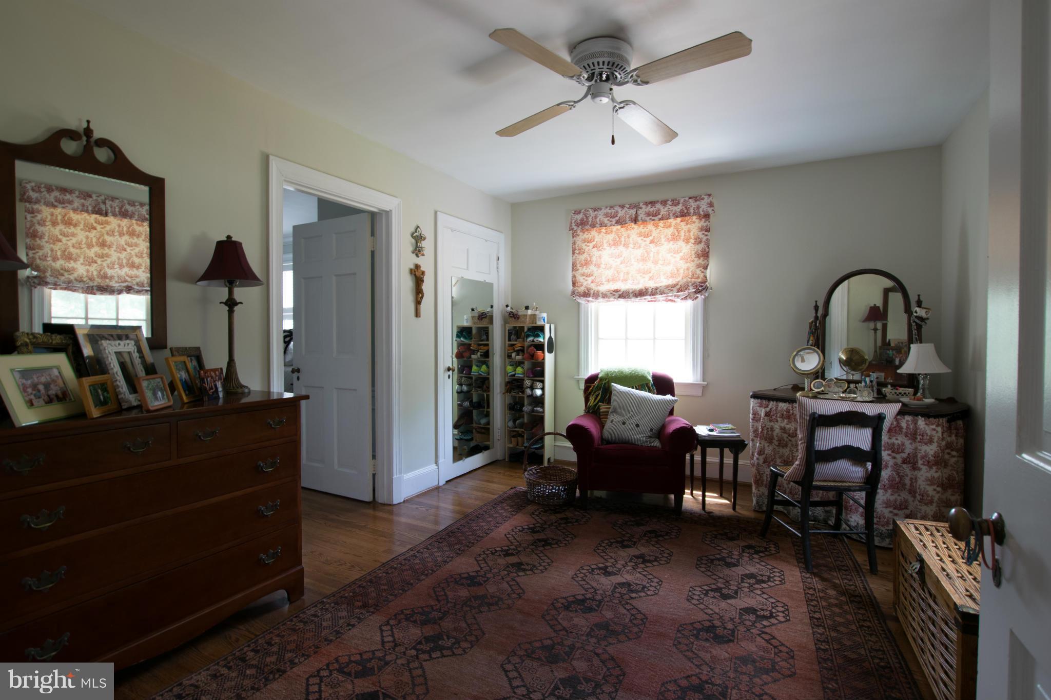 122 Midhurst Road Baltimore, MD 21212 - Photo 20 of 21 a living room with furniture a window and gym equipment