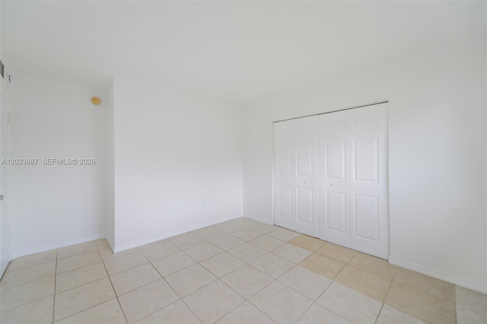 7737 Southwest 88th Street, Unit C312 Miami, FL 33156 - Photo 16 of 32 a view of an empty room