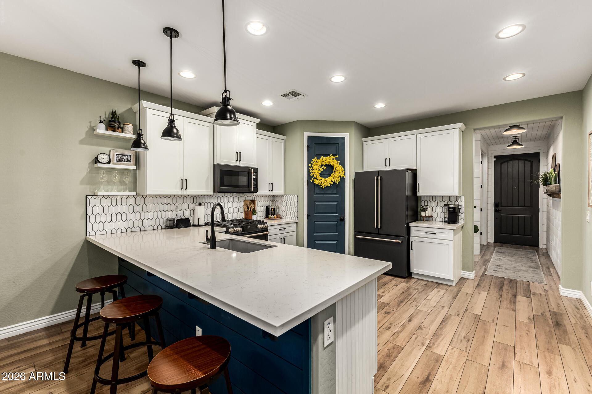 20416 Rosa Road Queen Creek, AZ 85142 - Photo 16 of 51 a kitchen with sink cabinets and stainless steel appliances