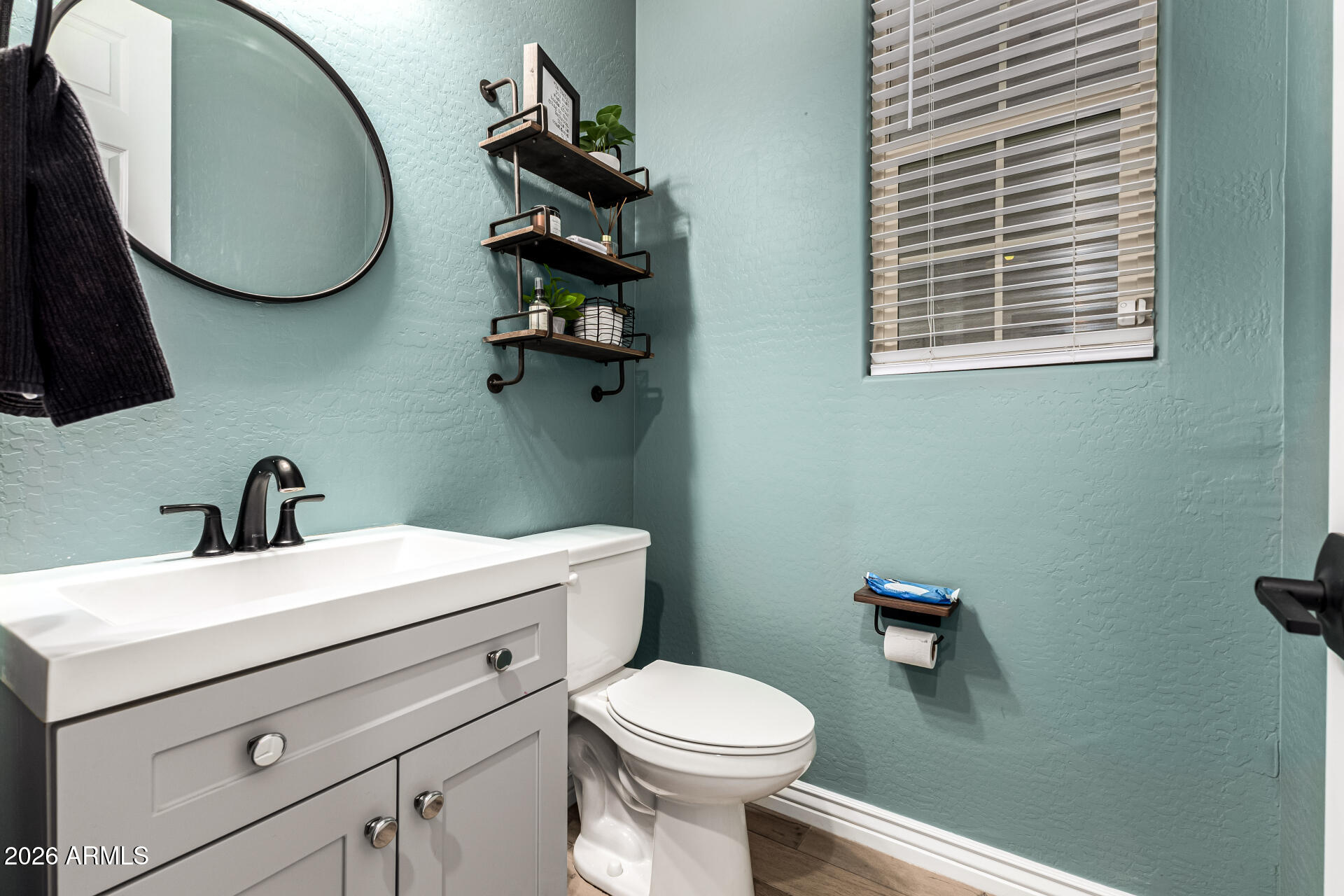 20416 Rosa Road Queen Creek, AZ 85142 - Photo 19 of 51 a bathroom with a toilet sink and mirror