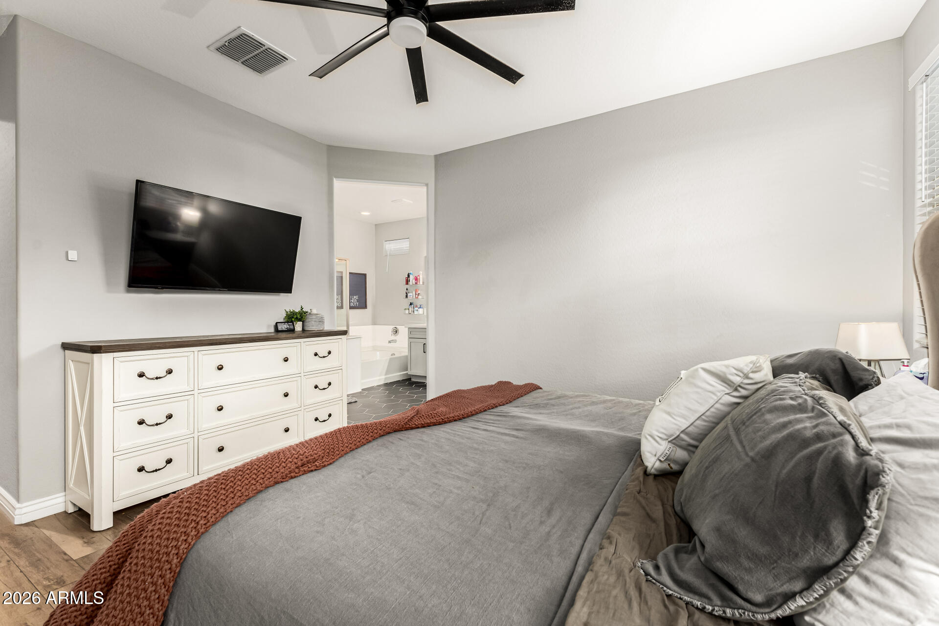 20416 Rosa Road Queen Creek, AZ 85142 - Photo 22 of 51 a bedroom with a bed and a flat screen tv