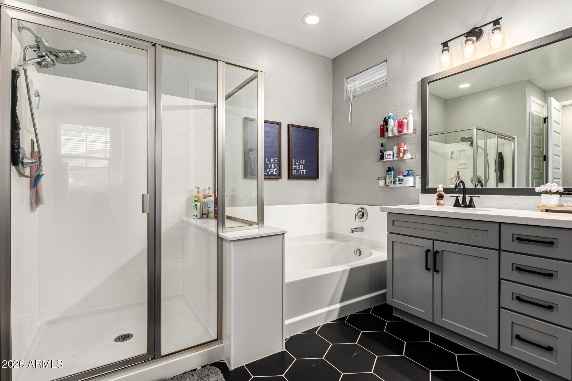 20416 Rosa Road Queen Creek, AZ 85142 - Photo 23 of 51 a spacious bathroom with a shower sink and mirror