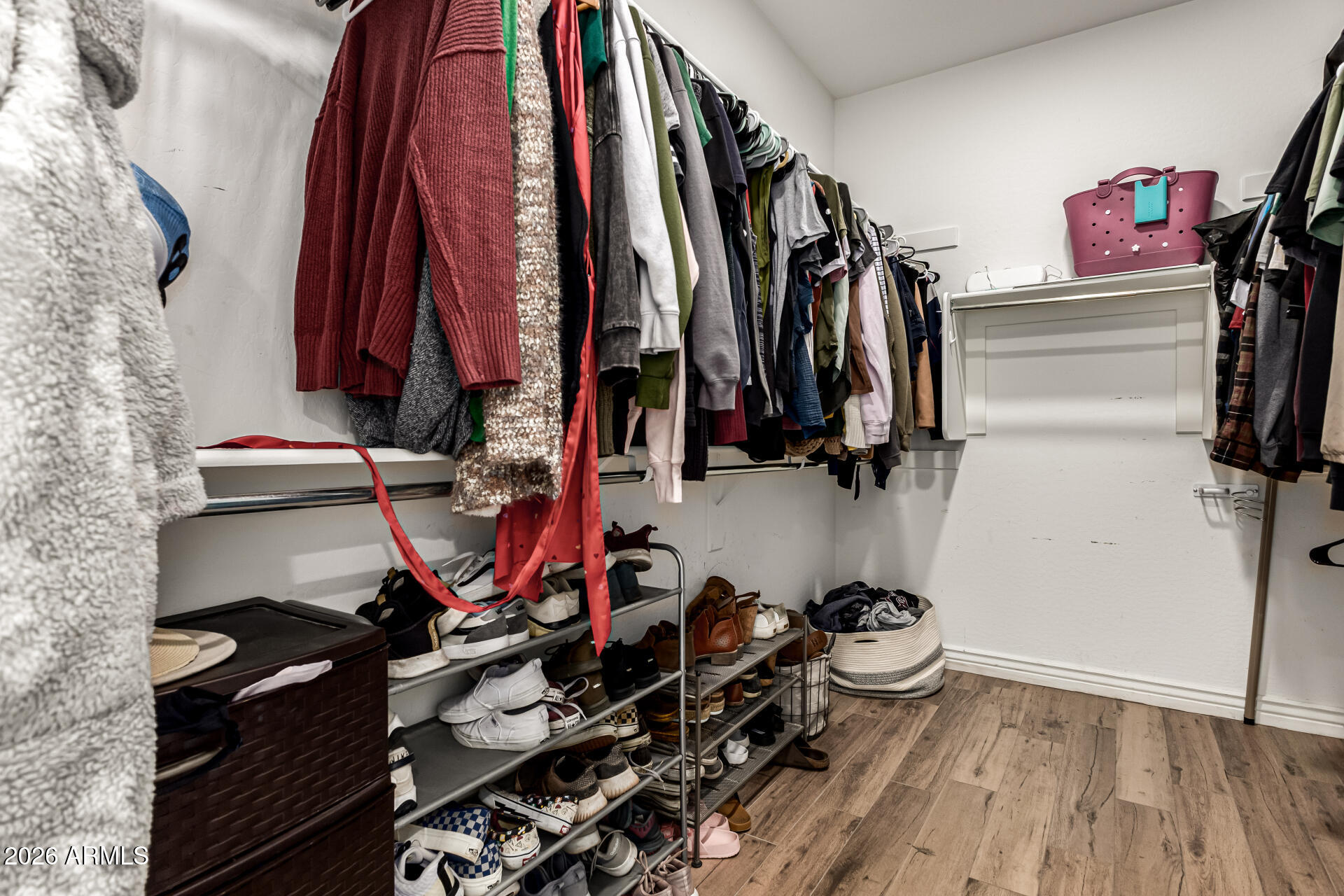 20416 Rosa Road Queen Creek, AZ 85142 - Photo 25 of 51 a view of walk in closet with clothes and shoes