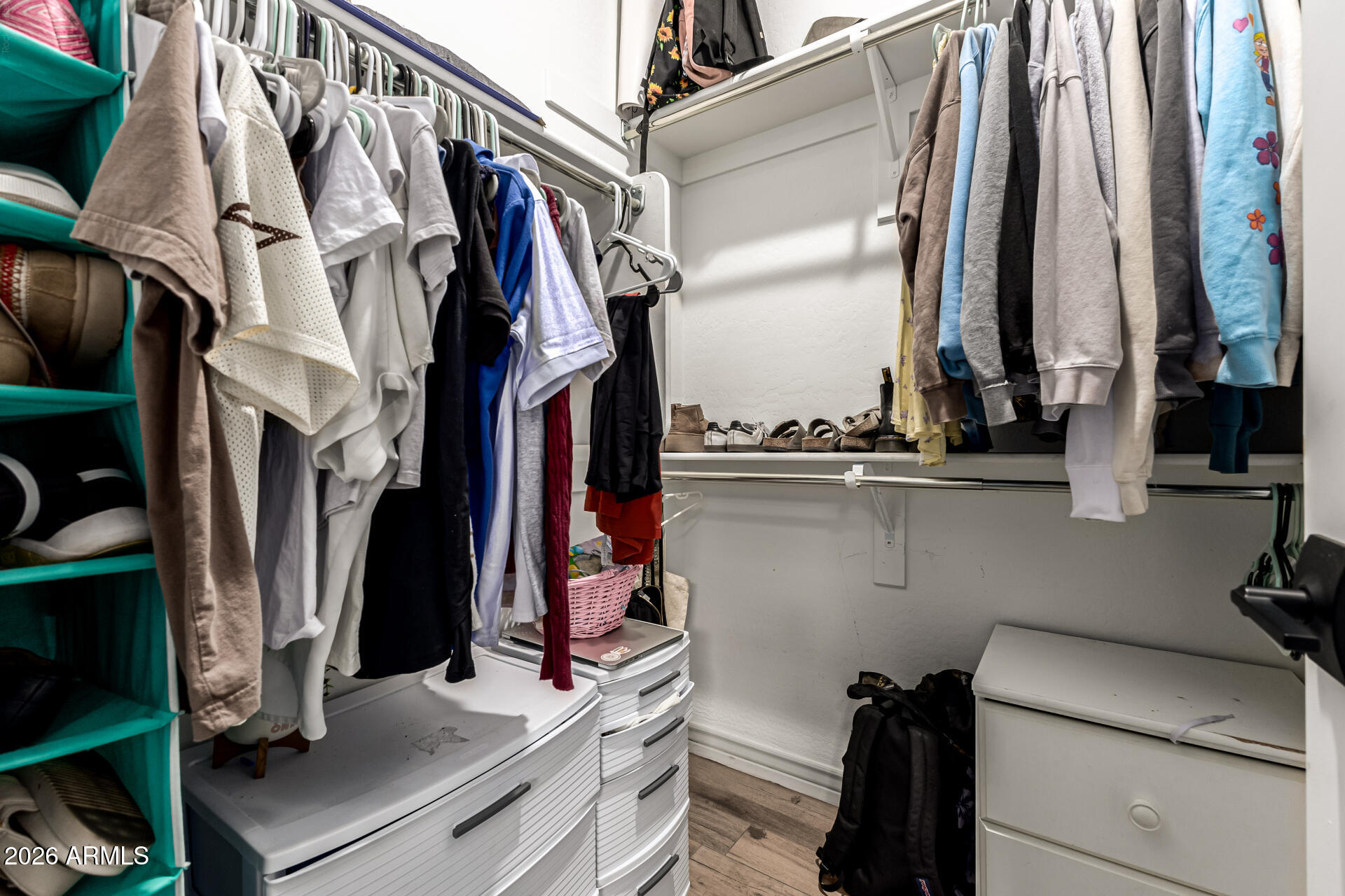 20416 Rosa Road Queen Creek, AZ 85142 - Photo 29 of 51 a view of walk in closet with clothes and shoes
