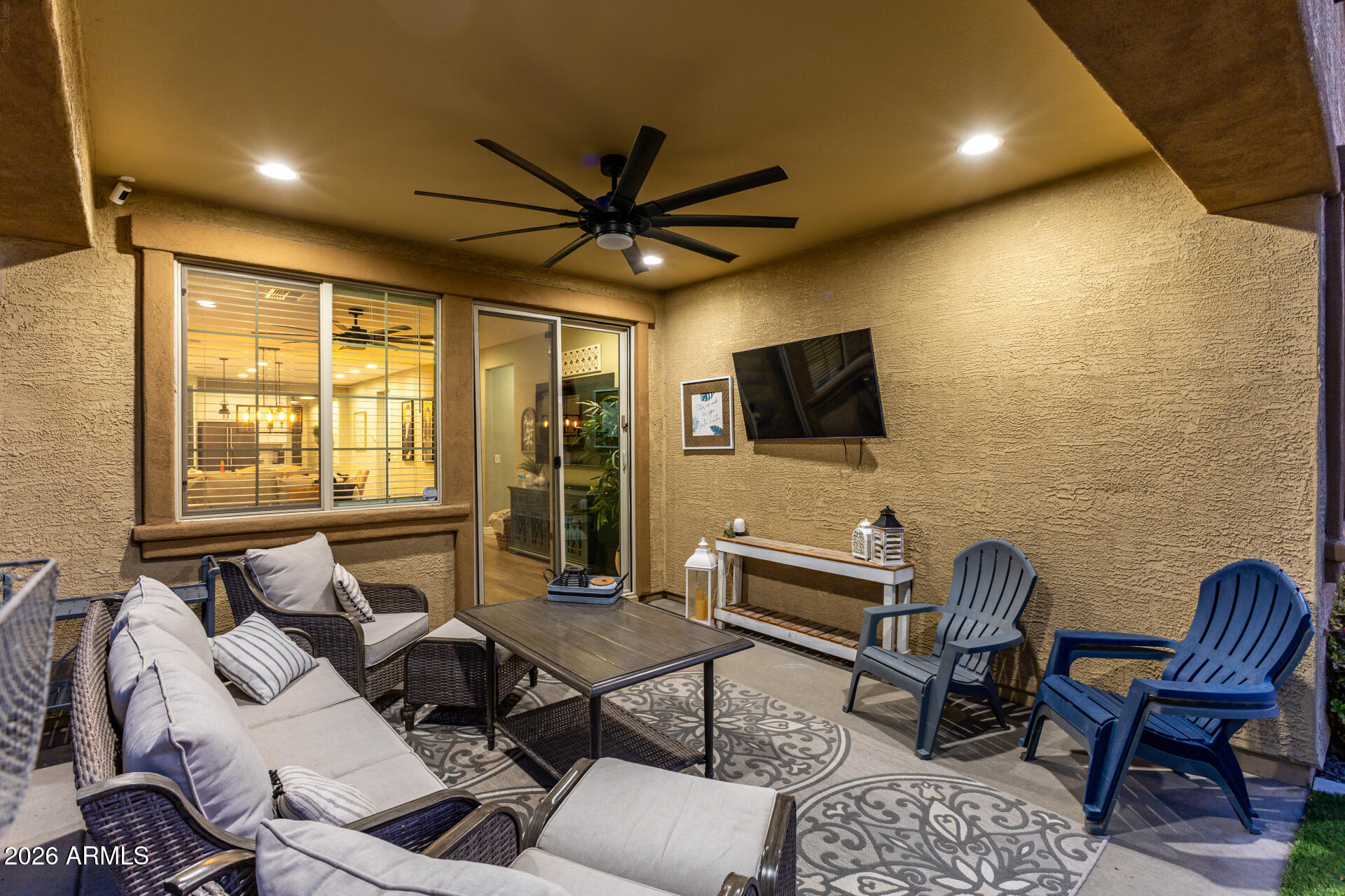 20416 Rosa Road Queen Creek, AZ 85142 - Photo 39 of 51 a living room with furniture and a flat screen tv