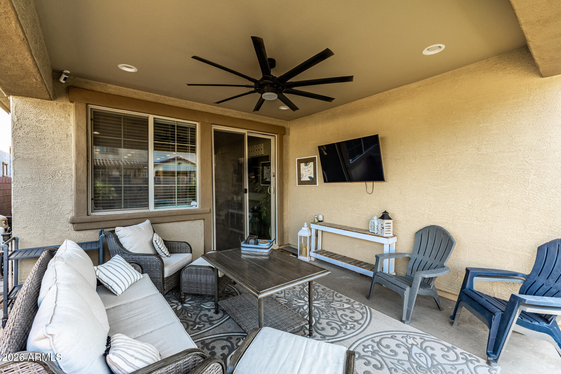 20416 Rosa Road Queen Creek, AZ 85142 - Photo 47 of 51 a living room with furniture a flat screen tv and a window