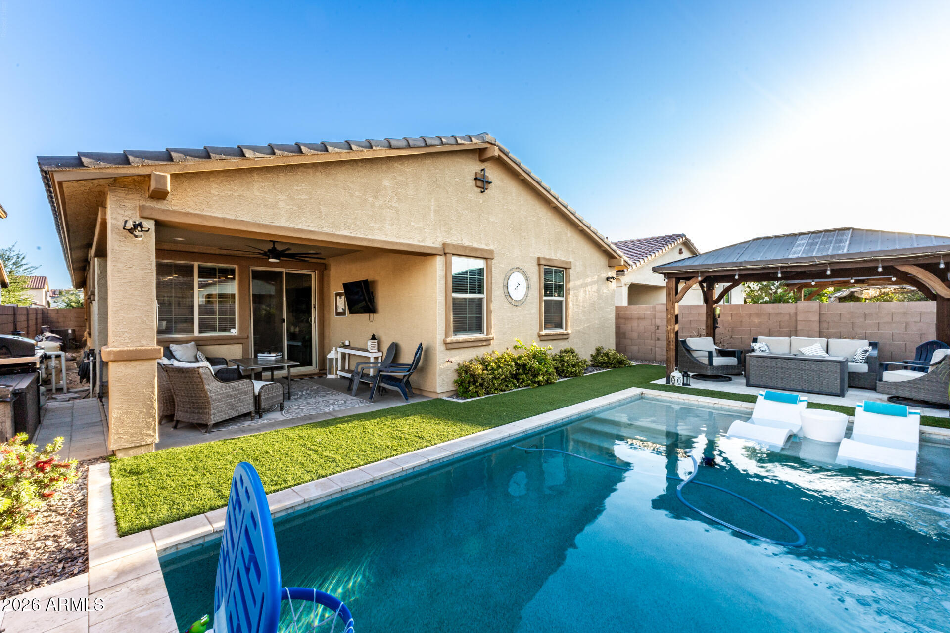 20416 Rosa Road Queen Creek, AZ 85142 - Photo 48 of 51 a view of a house with backyard porch and sitting area