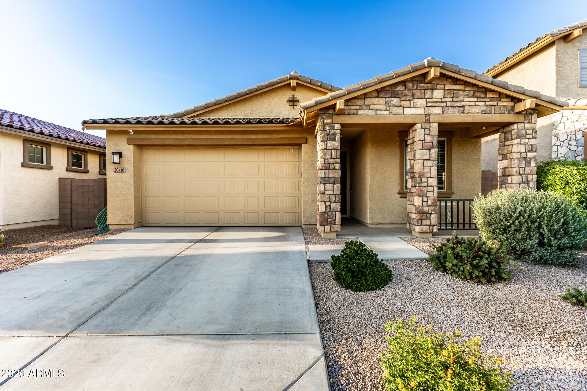 20416 Rosa Road Queen Creek, AZ 85142 - Photo 6 of 51 a front view of a house with a yard and garage