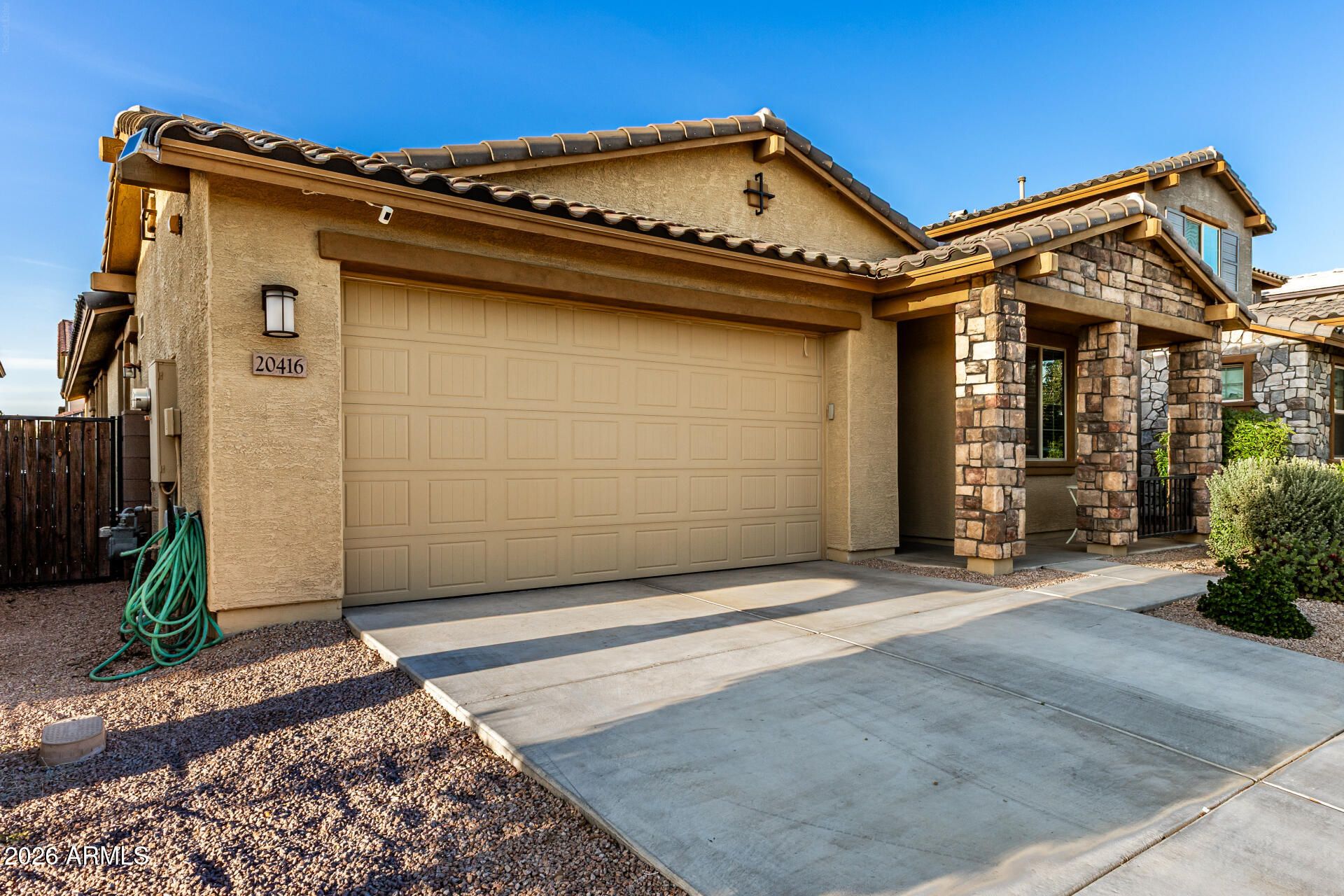 20416 Rosa Road Queen Creek, AZ 85142 - Photo 8 of 51 a view of a house with potted plants