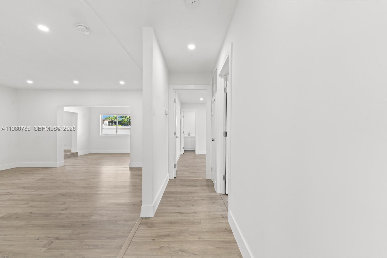 7971 Northwest 3rd Place Margate, FL 33063 - Photo 22 of 41 a view of a hallway with wooden floor