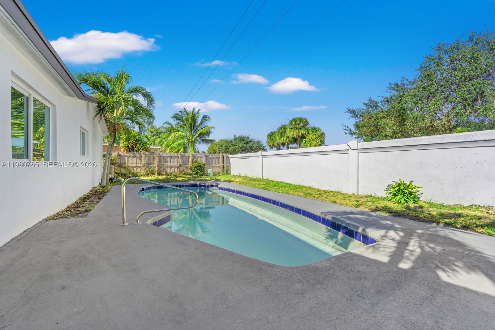 7971 Northwest 3rd Place Margate, FL 33063 - Photo 35 of 41 a view of swimming pool with a patio