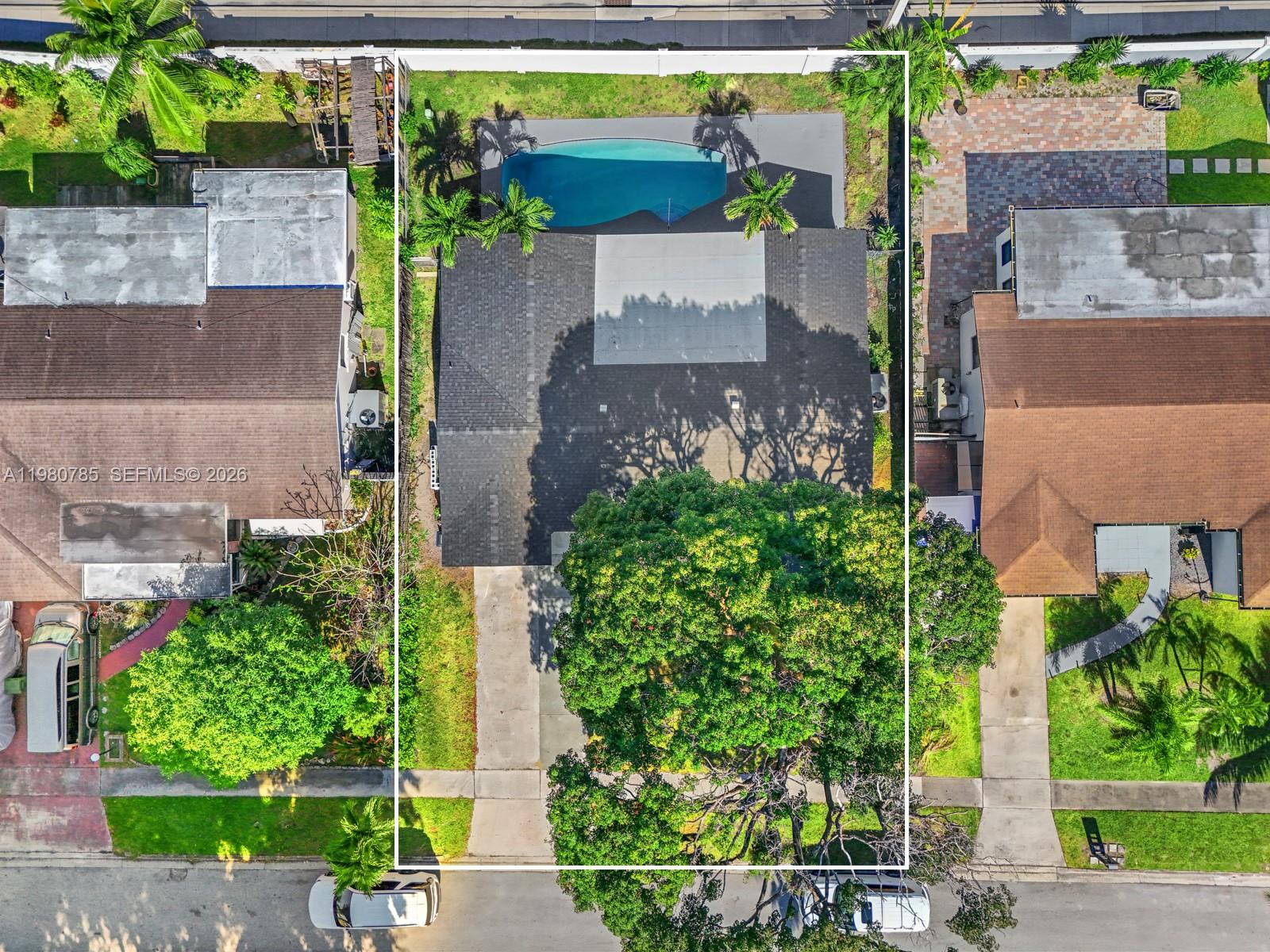 7971 Northwest 3rd Place Margate, FL 33063 - Photo 36 of 41 an aerial view of a house with a yard and a bench