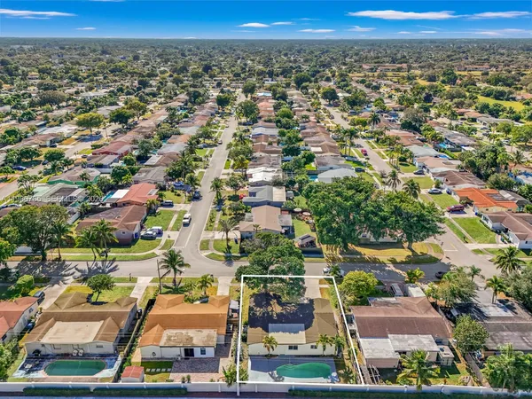 an aerial view of residential house with outdoor space