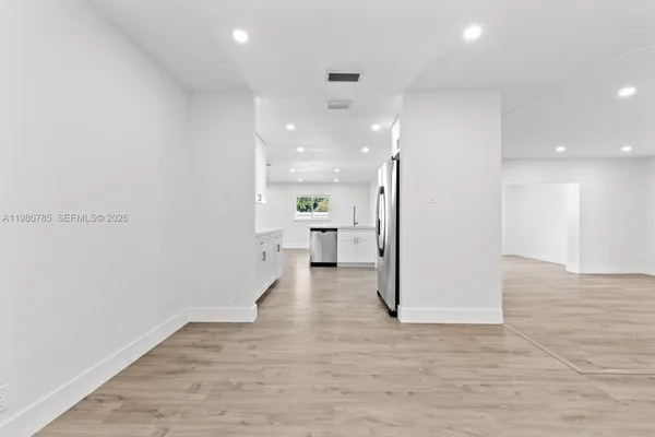 a view of a living room with a wooden floor