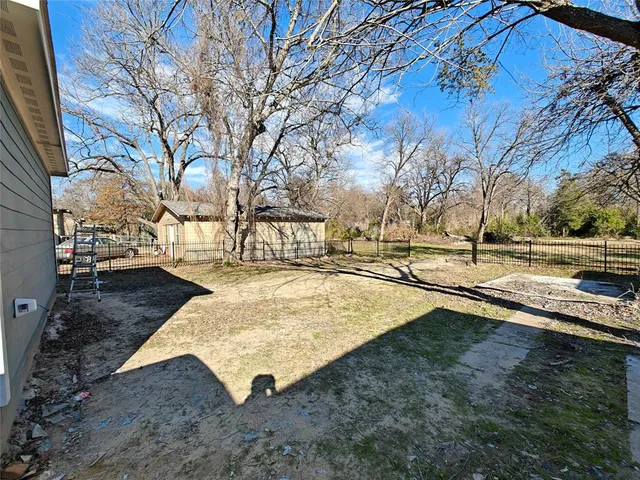 a view of outdoor space yard and blue swimming pool