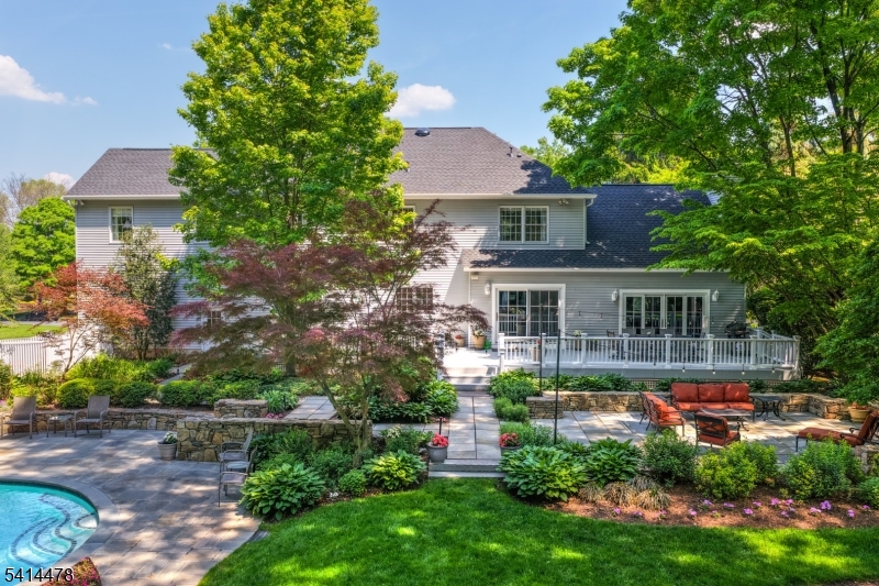 33 St Nickolas Way Bernards, NJ 07920 - Photo 1 of 50 a front view of a house with a yard table and chairs