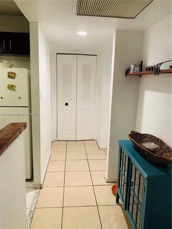 a view of a livingroom with a washer and dryer