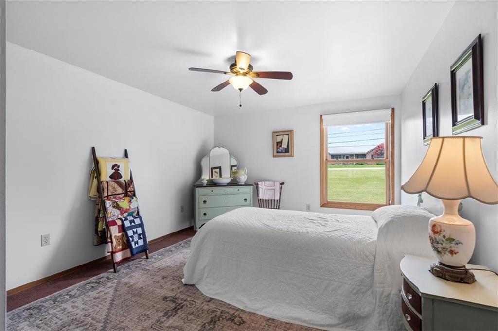 284 McKee Road Washington, PA 15301 - Photo 12 of 35 a bedroom with a bed and a chandelier