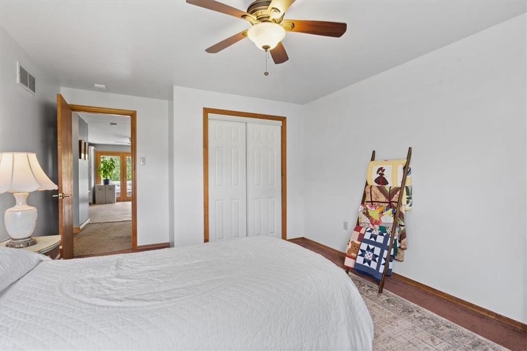 284 McKee Road Washington, PA 15301 - Photo 13 of 35 a bedroom with a bed and a chandelier