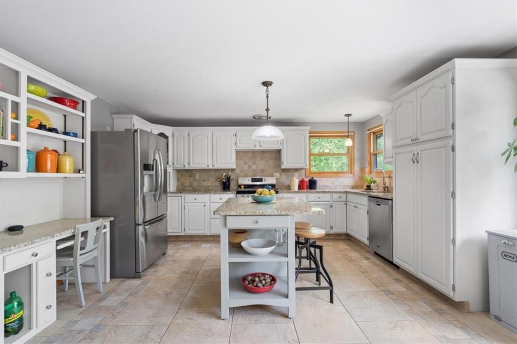 284 McKee Road Washington, PA 15301 - Photo 9 of 35 a kitchen with stainless steel appliances granite countertop a refrigerator and a stove top oven
